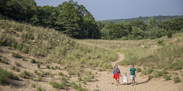 Family on the dunes in grand mere state park