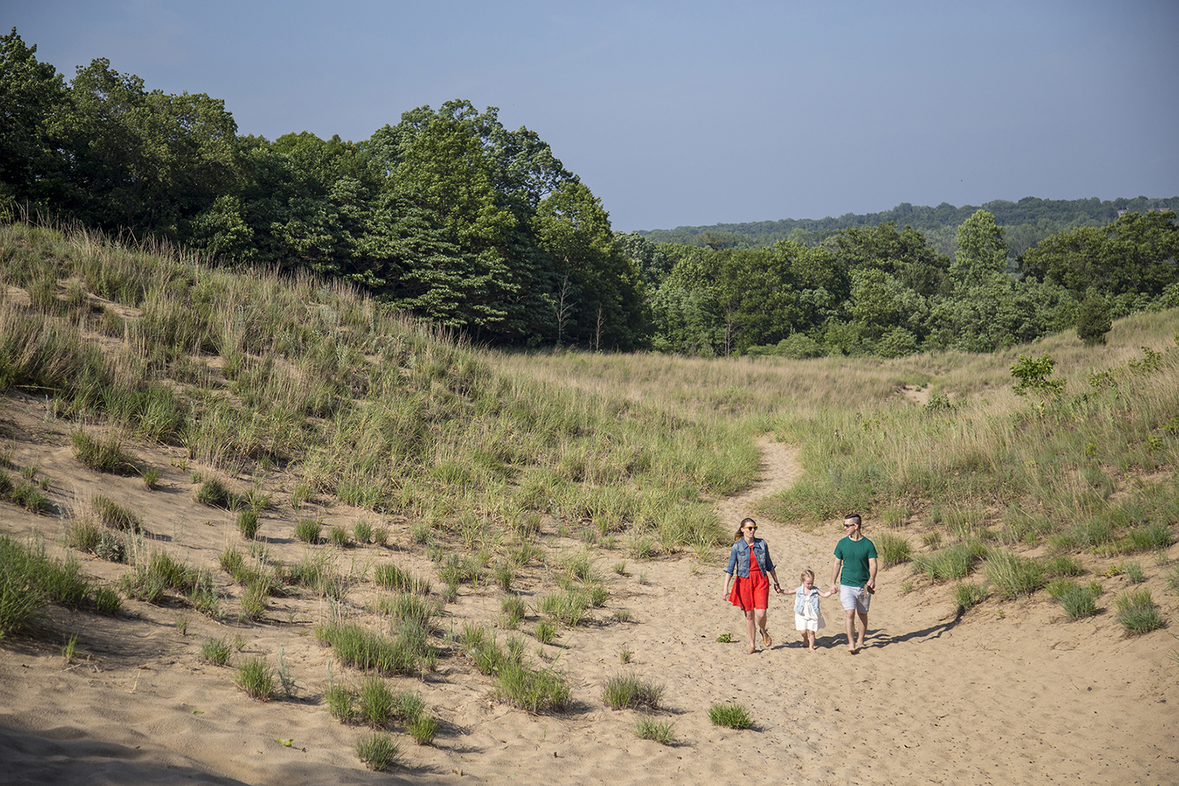 Family on the dunes in grand mere state park