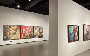 Art exhibition showcasing a series of vibrant paintings mounted on white walls in a gallery setting at Muskegon Museum of Art.